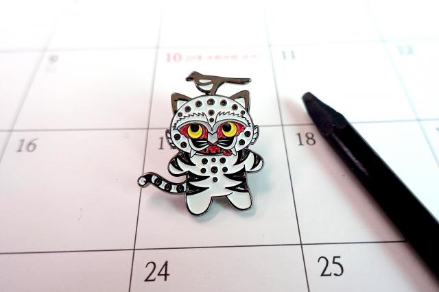 MU:DS ‘magpie and tiger’ badge. (National Museum Foundation of Korea)