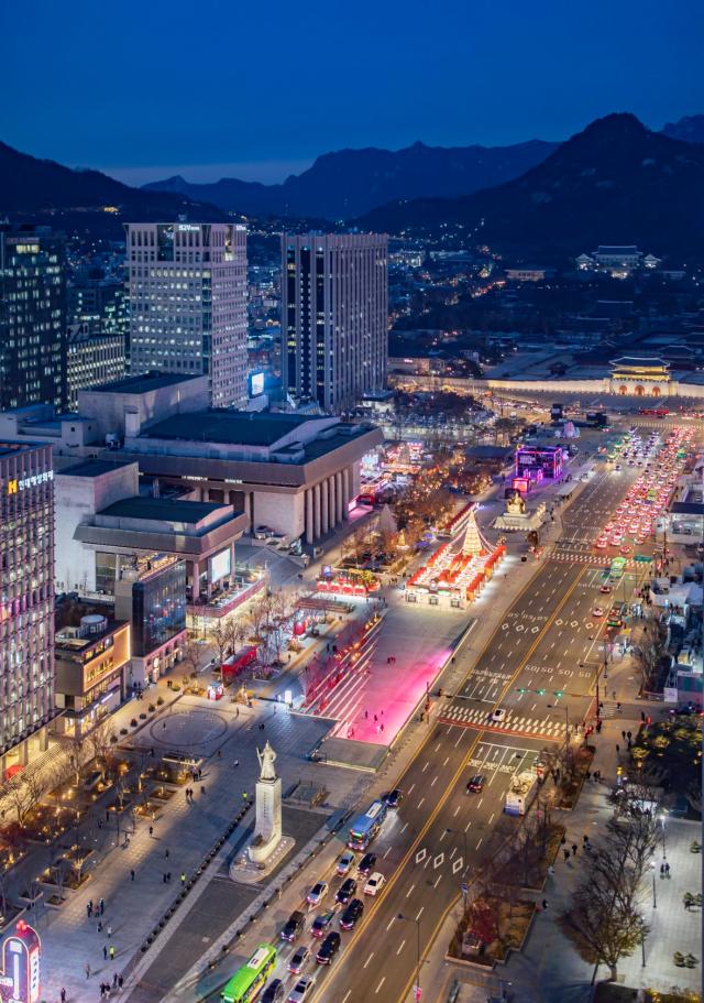 This image shows a photograph shared by an international BTS fan on X highlighting the historical and cultural significance of Gwanghwamun Square ahead of the group’s comeback