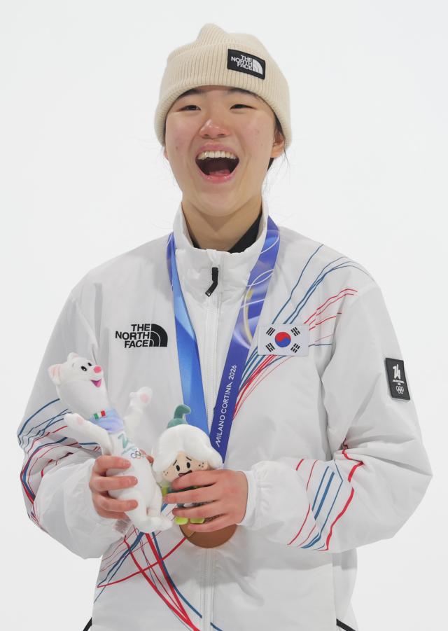 South Korean snowboarder Yu Seung-eun smiles on the podium after winning the bronze medal in the womens snowboard big air event at the Milano Cortina 2026 Winter Olympic Games at Livigno Snow Park in Livigno Italy on February 9 local time YONHAP