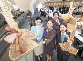 Korean Air, Asiana Hang Lucky Brooms for Lunar New Year at Major Sites
