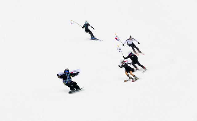Skiers dressed as athletes from various winter sports cheer alongside regular skiers and snowboarders during a cheering event at Konjiam Resort ski resort in Gwangju Gyeonggi Province on Feb 10 2026 AJP Yoo Na-hyun