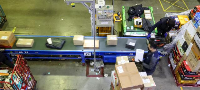 Workers sort parcel boxes at the Dongseoul Mail Logistics Center in Seoul’s Gwangjin Ward ahead of the Lunar New Year holiday on Feb 11 2026 AJP Yoo Na-hyun