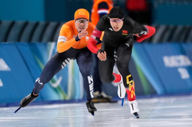 Lian Ziwen of China right hinders Joep Wennemars of the Netherlands when changing lanes in the mens 1000 meters speedskating race at the 2026 Winter Olympics in Milan Italy Wednesday Feb 11 2026 AP PhotoLuca Bruno2026-02-12 033246 Courtesy of Yonhap News Agency