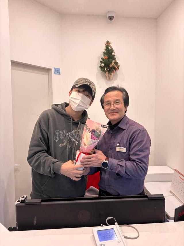 CEO and chairman pose at the lobby of A One Hotel in Itaewon, Seoul, on Feb. 11, 2026.  AJP Ryu Yuna