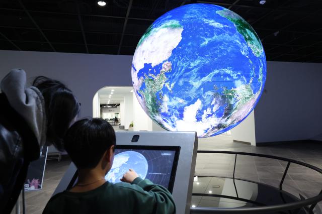 Visitors view an exhibition at My Friend Seoul gallery at Seoul City Hall Feb 12 2026 AJP Han Jun-gu