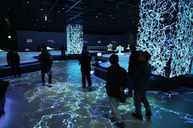 Visitors view an exhibition at My Friend Seoul gallery at Seoul City Hall Feb 12 2026 AJP Han Jun-gu