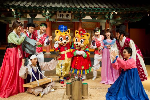 This photo provided by Lotte World show people participating in Korean traditional games Courtesy of Lotte World