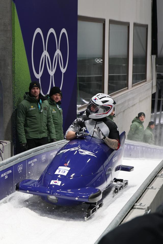 South Koreas pilot Suk Young-jin and brakeman Chae Byung-do finish their race at the 