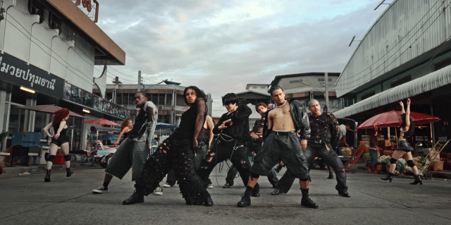 This photo captured from J-Hopes official music video for His solo track Killin it Girl released in 2025 show J-hope dancing with a crew Photo captured from Official HYBE Label youtube cahnnel