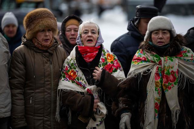 People attend a memorial service honouring the victims of the peaceful march to the Ukrainian Verkhovna Rada on February 18 2014 during the mass Euromaidan protests in Kyiv on February 18 2026 amid the Russian invasion of Ukraine AFPYonhap