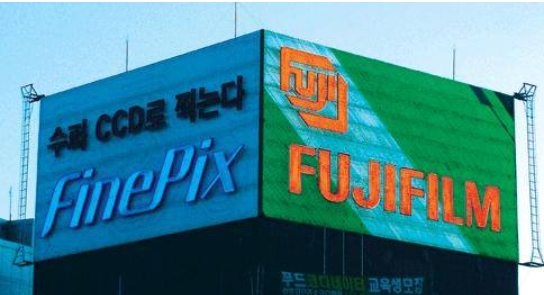 This photo captured from Mediamans Naver Blog show mixture of traditional advertisement with colorful neon lights combined which dates back to 1988 