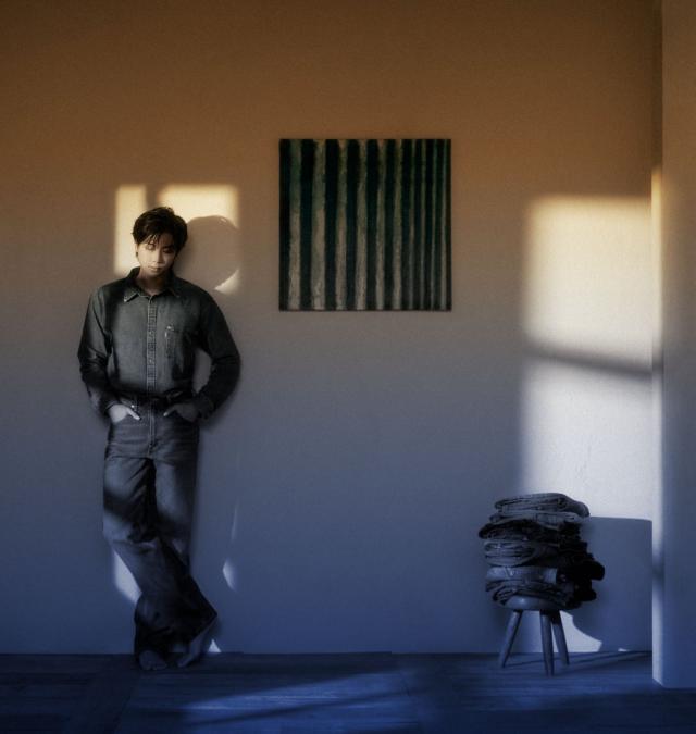 This photo captured from SFMOMA show BTS RM standing next to one of his collections 