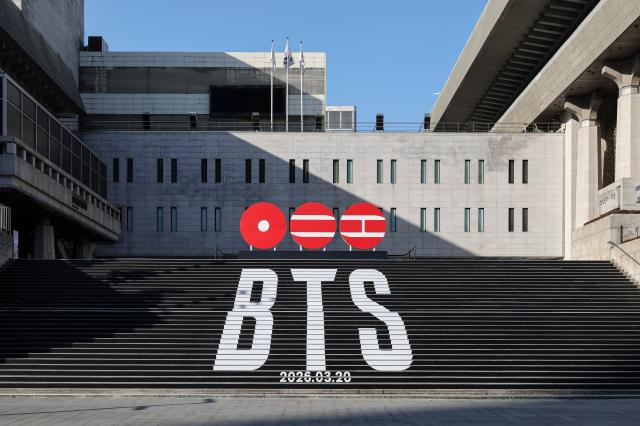 The BTS logo and the groups comeback date are shown on the steps of the Sejong Center AJP Yoo Na-hyun