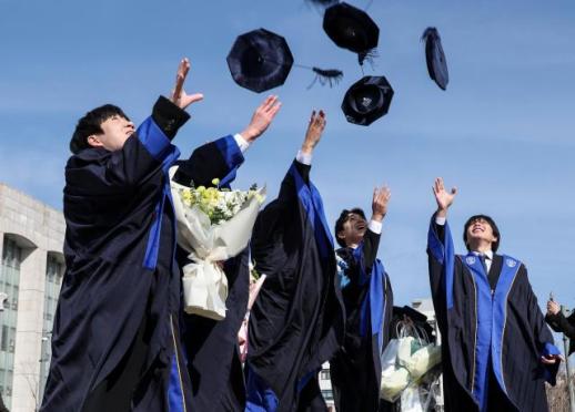 Caps, flowers, and farewells in February commencement