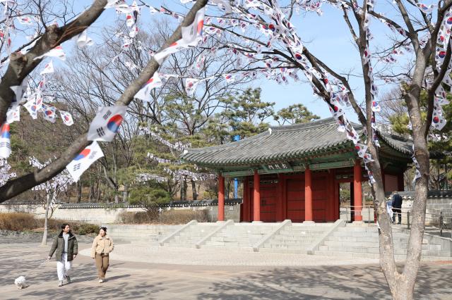 Visitors take a walk on the Taegeukgi Korean flag Street at Hyochang Park in Yongsan-gu Seoul Feb 23 2026 AJP Han Jun-gu