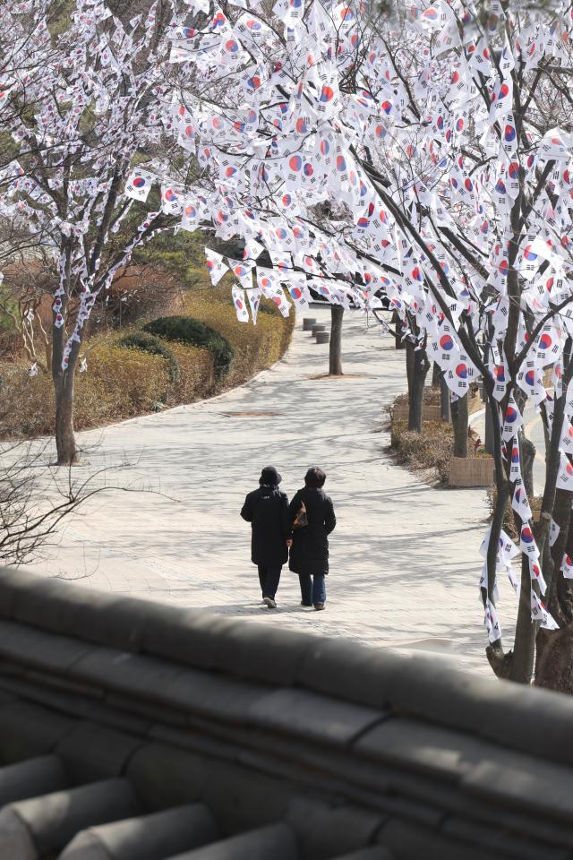 Visitors take a walk on the Taegeukgi Korean flag Street at Hyochang Park in Yongsan-gu Seoul Feb 23 2026 AJP Han Jun-gu