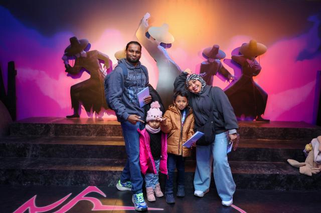 Visitors pose at the Saja-boys booth during the K-Pop Demon Hunters pop-up store held in Seoul on December 10 2025 AJP Yoo Na-hyun
