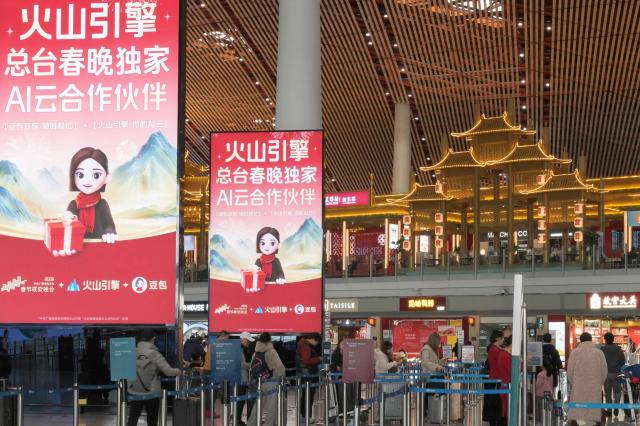 This picture taken on February 5 2026 shows advertising promoting ByteDances cloud and AI service platform Volcano Engine and chatbot Doubao at the Beijing Capital International airport in Beijing AFP-Yonhap 