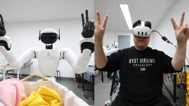 Aei Robots M1 model imitates an engineers double-peace sign at Hanyang University ERICA Campus Feb 23 2026 AJP Han Jun-gu