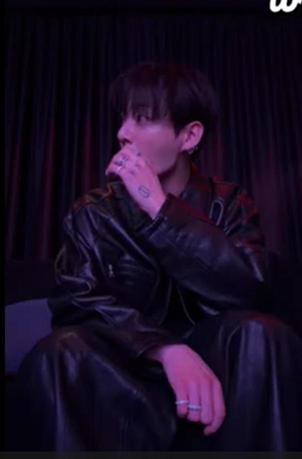 This photo captured from Weverse Live of BTS Jungkook show Jungkook chatting with his friends