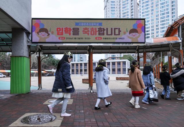 New first-grade students head to their classrooms after attending the entrance ceremony for the 2026 academic year at Wonchon Elementary School in Seocho District Seoul on March 3 2026 AJP Yoo Na-hyun