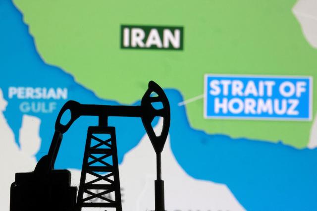 A 3D-printed oil pump in front of a map showing the Strait of Hormuz Reuters-Yonhap