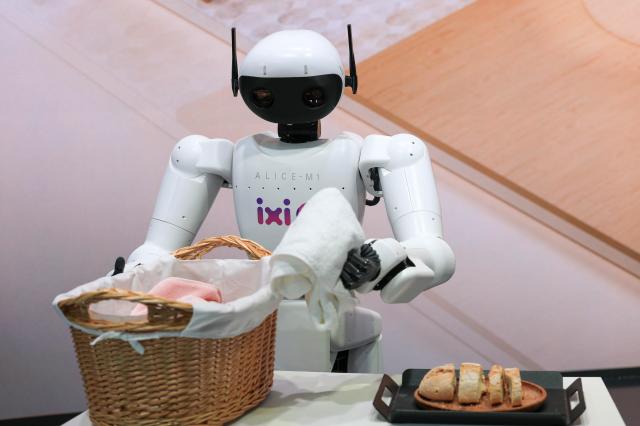 A robot demonstrating the future of LG Uplus AI agent ixi-O moves laundry at the companys MWC 2026 booth Courtesy of LG Uplus