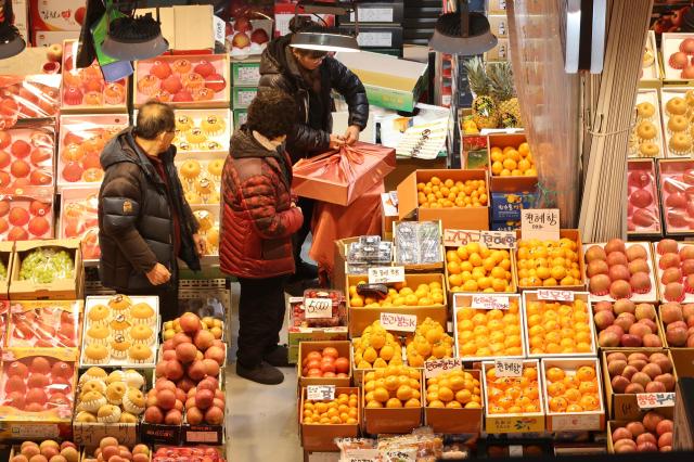Shoppers at Namcheon fresh food wholesale market in Incheon ahead of Lunar New Years holiday on Feb 13 2026 AJP Han Jun-gu