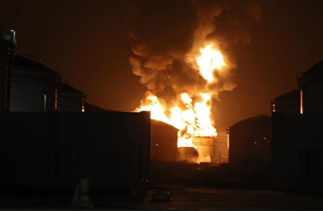 Flames rise during a fire casued by debris from an intercepted drone at the oil refinery hub in Fujeirah United Arab Emirates 04 March 2026 Iran continued to launch retaliatory attacks across the region following a joint US-Israeli military operation that started in the early hours of 28 February 2026 targeting multiple locations across Iran EPAYONHAP
