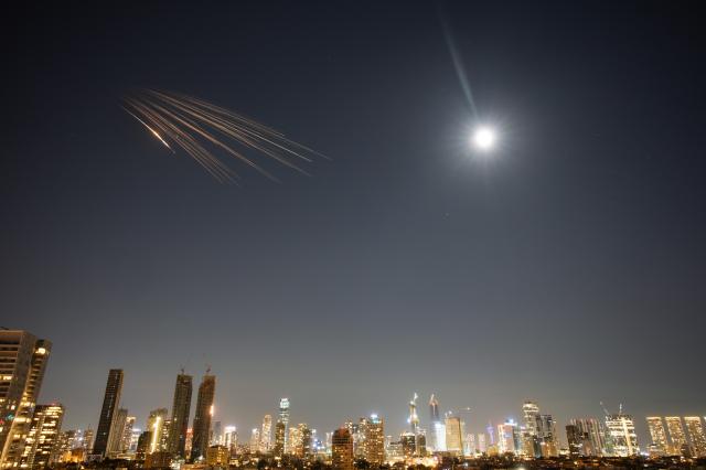 Missiles launched from Iran are seen in the sky over central Israel Thursday March 5 2026 AP-Yonhap 