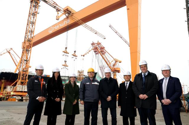 Stephen Fuhr Canada’s special envoy for defence procurement fourth from right poses for a photo with officials during a visit to Hanwha Ocean’s Geoje shipyard on Feb 2 2026 Courtesy of Hanwha Ocean