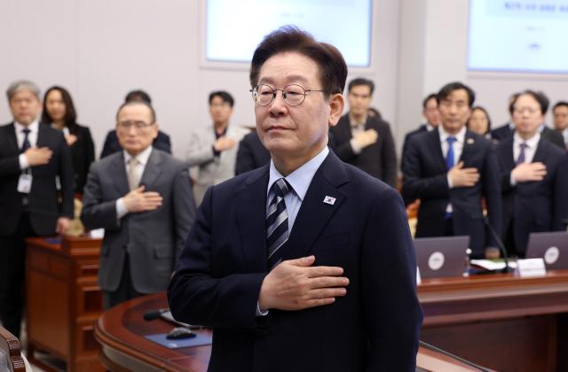 Lee Jae Myung president of South Korea salutes the national flag during a senior presidential aides’ meeting at the Cheong Wa Dae on Mar 12 Yonhap 

