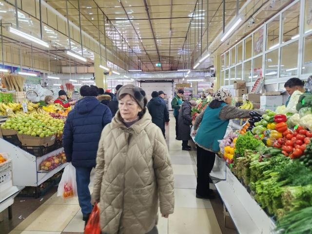 Shoppers busily move through aisles between stalls at the Artyom Market in the old quarter of Astana on March 12 AJP Park Sae-jin