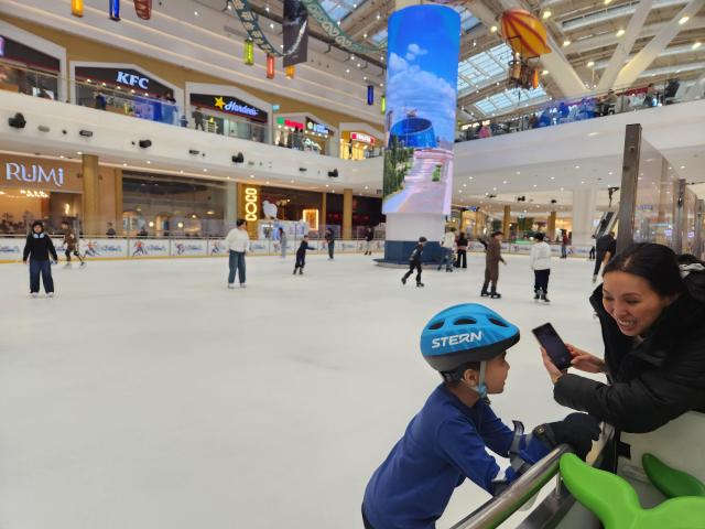 Shoppers have fun on the ice rink located inside the Mega Silk Way mall in Astanas new district on March 15 AJP Park Sae-jin