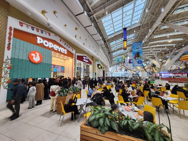 Dozens of shoppers fill the food court of the Mega Silk Way mall in Astanas new district on March 15 AJP Park Sae-jin