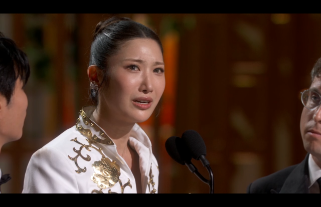 This photo captured during the live event of 98th Oscar show EJAE giving out an acceptance speech for the highly anticipated Best Original Song“ award