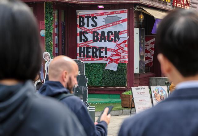 A banner welcoming fans of BTS known as ARMY hangs at a pub in Mugyo-dong Jung-gu central Seoul five days ahead of the group’s Gwanghwamun comeback performance March 16 2026 AJP Yoo Na-hyun 20260316