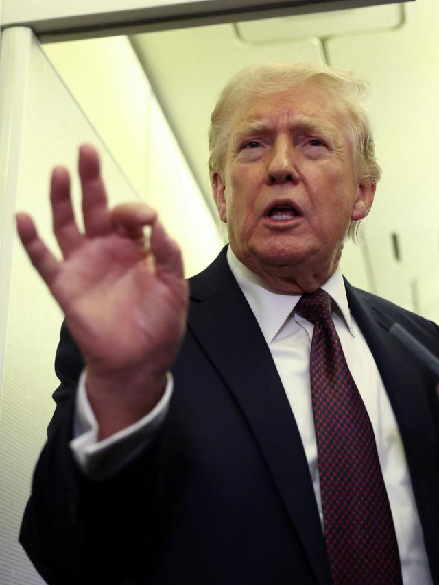 US President Donald Trump speaks to reporters aboard Air Force One on a flight back to Washington Mar 15 2026 Reuters-Yonhap 