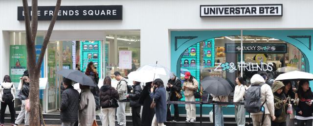 Local and international K-pop fans line up outside the LINE FRIENDS Square Myeongdong in Myeong-dong Seoul ahead of BTS’s comeback concert at Gwanghwamun scheduled for March 21 on March 15 2026 