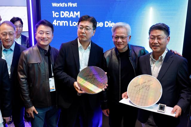 Jensen Huang poses for a photo with Samsung executives at the NVIDIA GTC 2026 Reuters-Yonhap
