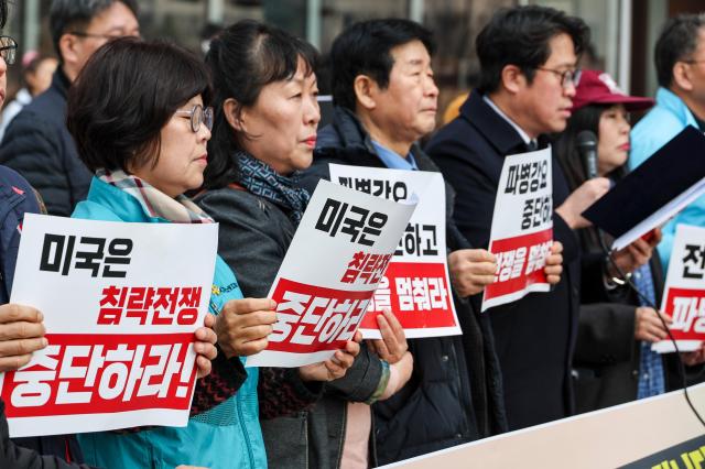 An emergency press conference by Seoul civic groups opposing a possible deployment to the Strait of Hormuz and war is held in front of the KT building in Gwanghwamun central Seoul March 17 2026 AJP Yoo Na-hyun