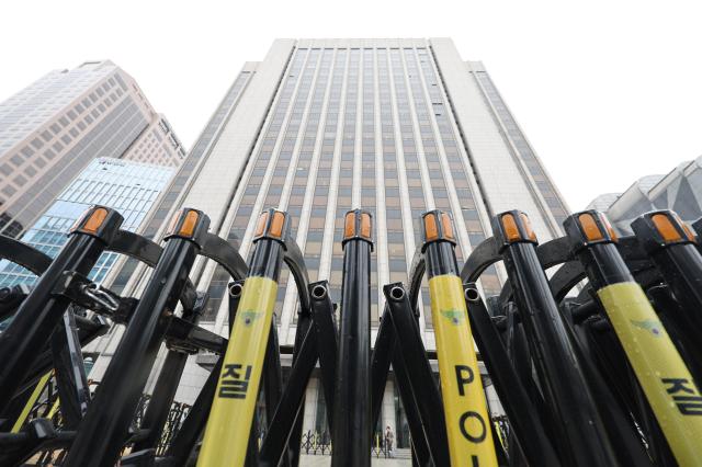 Security perimeters are being expanded around major buildings and roadways with metal fencing and buffer zones installed to prevent overcrowding near key access points AJP Han Jung-gu March 18 2026