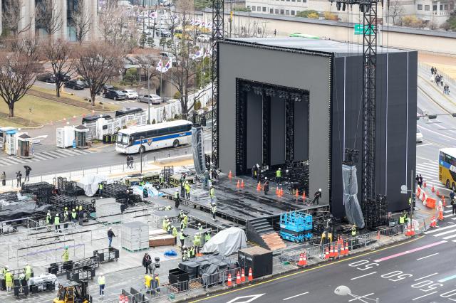 Stage installation is underway at Gwanghwamun Square in Jongno District Seoul three days ahead of the BTS performance March 18 2026 AJP Yoo Na-hyun 20260318
