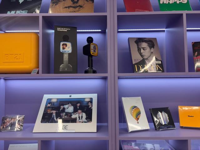 BTS merchandise including albums character goods and microphones are displayed at a K-pop shop in Myeongdong Seoul on March 18 2026 AJP Ryu Yuna
