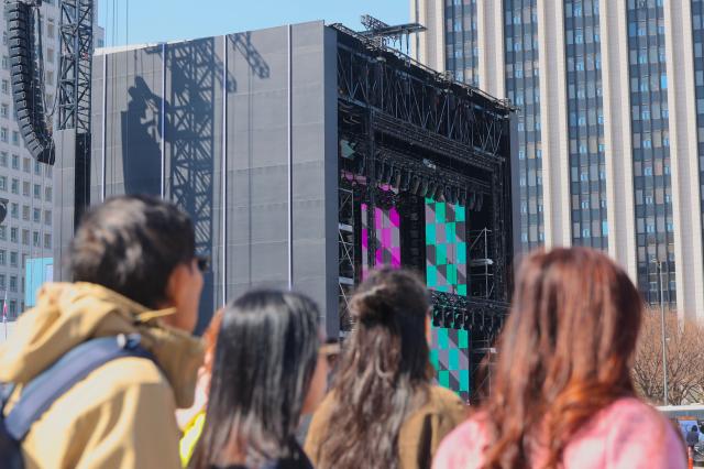 People look at the stage to be used for the BTS performance at Gwanghwamun Plaza in Seoul March 19 2026 AJP Han Jun-gu 20260319