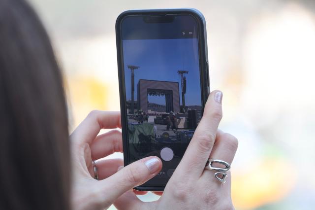 A tourist takes a photo of the stage at Gwanghwamun Plaza in Seoul March 19 2026 AJP Han Jun-gu 20260319
