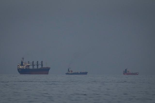 Oil tankers and ships line up in the Strait of Hormuz as seen from Khor Fakkan United Arab Emirates on March 11 2026 AP-Yonhap
