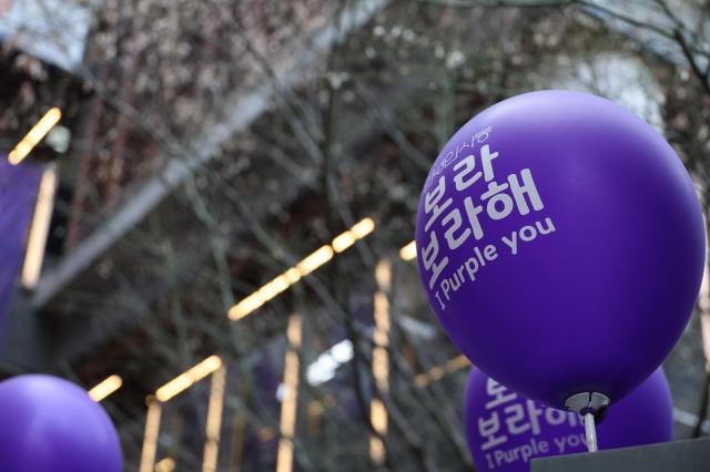 Shops buildings and allies adorn with purple decorations ahead of the March 21 BTS concert day March 20 2026 AJP Yoo Na-hyun