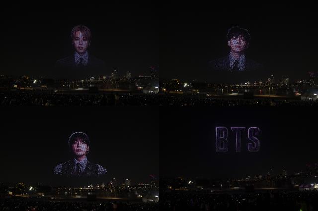 From left clockwise BTS members Jimin V and Jungkook along with the BTS logo are depicted by drones AJP Yoo Na-hyun 20260320
