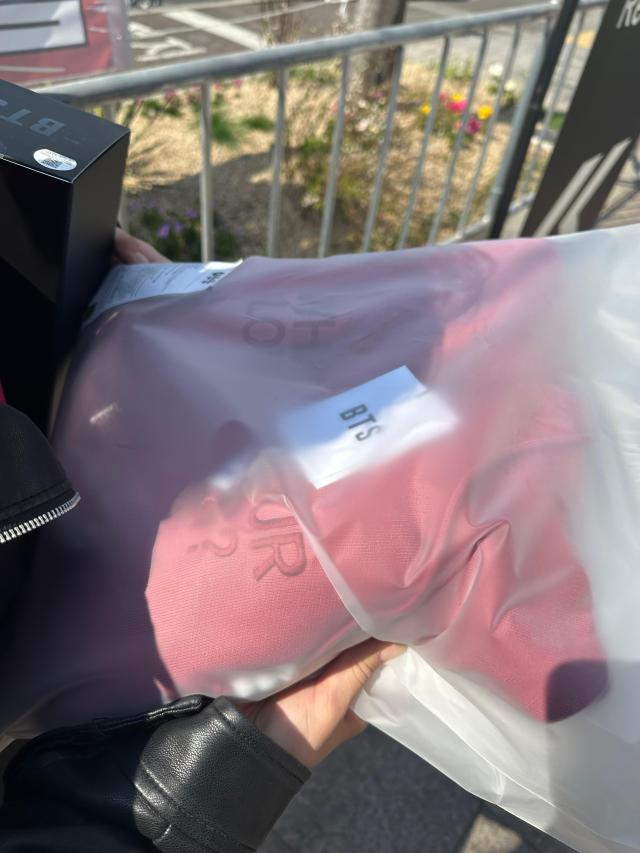 Lana Ro 25 Russia shows a BTS apparel is seen packaged after purchase at a pickup booth in Seoul on March 21 2026 AJP Kim Hee-su